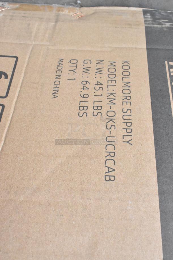 KoolMore KM-OKS-UCRCAB outdoor cabinet kitchen box, labeled with model info and weight details, new with scratches and dents.