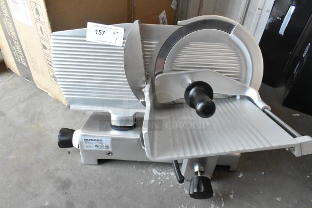 Brand new 2025 Bizerba GSE 12 meat and cheese slicer, 12" blade, manual gravity feed, 110V, scratches visible.