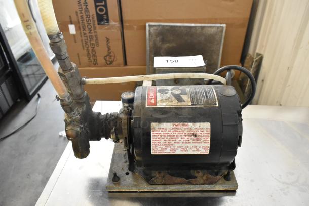 Cornelius Intelli Pump Motor, 115V, 1 Phase, worn condition. Warning labels and fittings visible on the motor.
