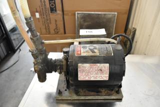 Cornelius Intelli Pump Motor, 115V, 1 Phase, worn condition. Warning labels and fittings visible on the motor.