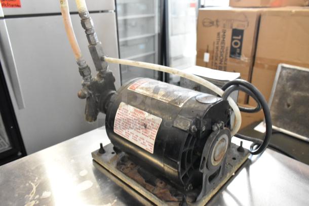 Cornelius Intelli Pump Motor, 115V, 1 Phase, visible labels with specifications and warnings, in used condition.