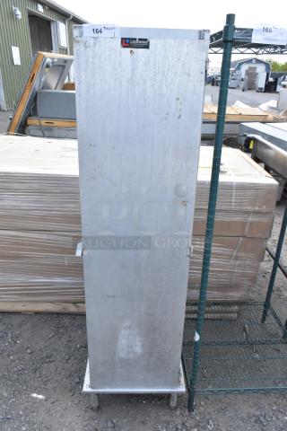 Lockwood metal commercial enclosed pan rack in used condition, featuring a sturdy design. Visible brand label on front.