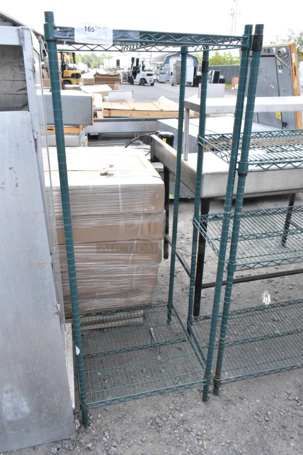 Green finish 2-tier wire shelving unit, sturdy condition. Buyer must dismantle; consider freight charges.