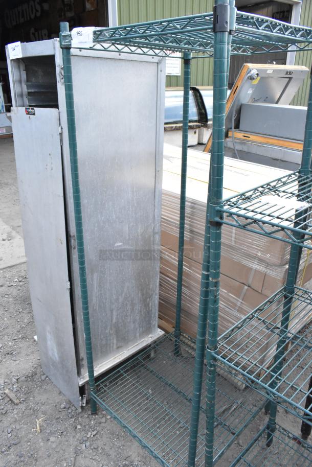 Green two-tier wire shelving unit, sturdy metal construction, visible signs of wear, buyer dismantles, freight needed.