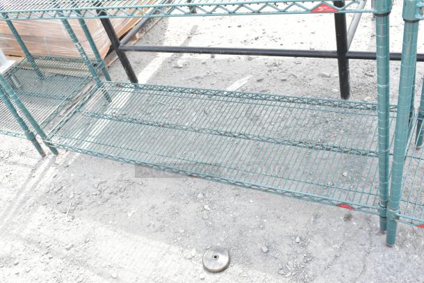 Green 3-tier wire shelving unit, sturdy metal construction, buyer must dismantle, ideal for storage, freight charges apply.