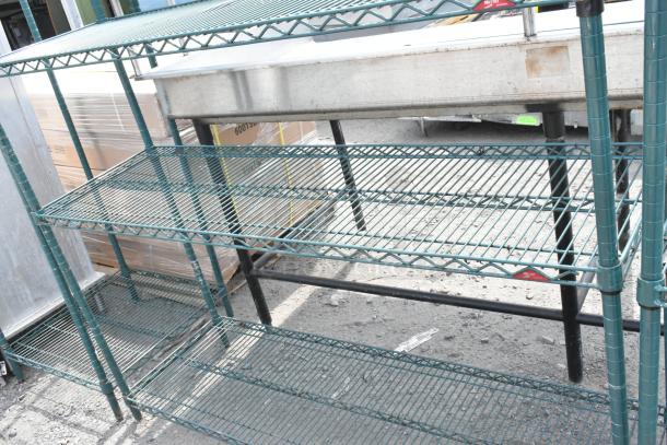 Green 3-tier wire shelving unit with a durable finish. Requires dismantling by buyer. Ideal for storage or display.