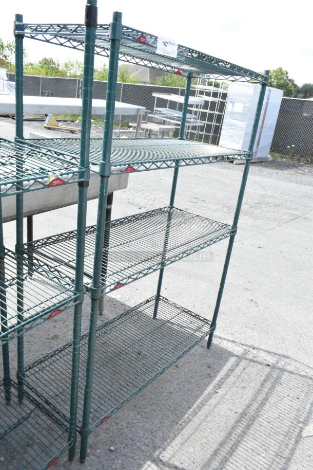 Green 4-tier wire shelving unit, outdoor setting, sturdy design. Dismantling required for shipping. Buyer arranges freight.
