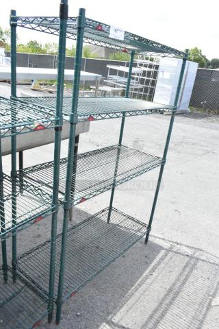 Green 4-tier wire shelving unit, outdoor setting, sturdy design. Dismantling required for shipping. Buyer arranges freight.