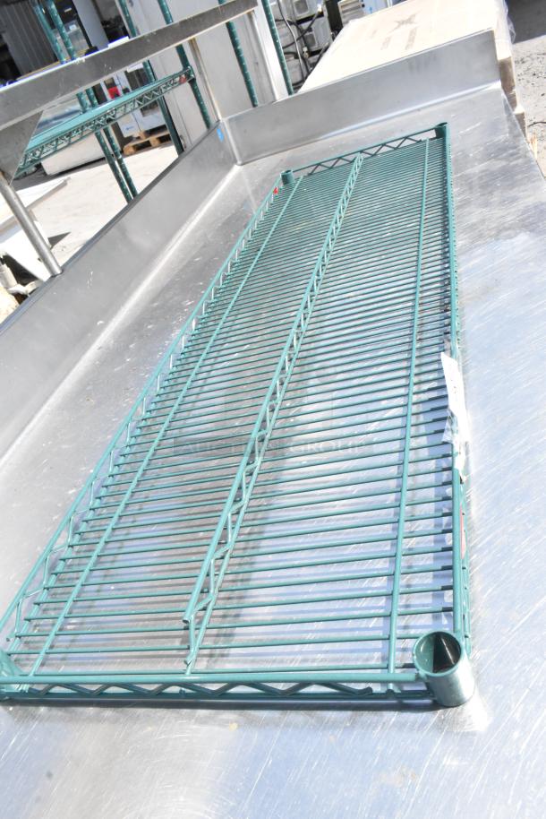 Metro green wire shelf, mint condition, sturdy metal construction, dimensions unspecified, suitable for storage solutions.