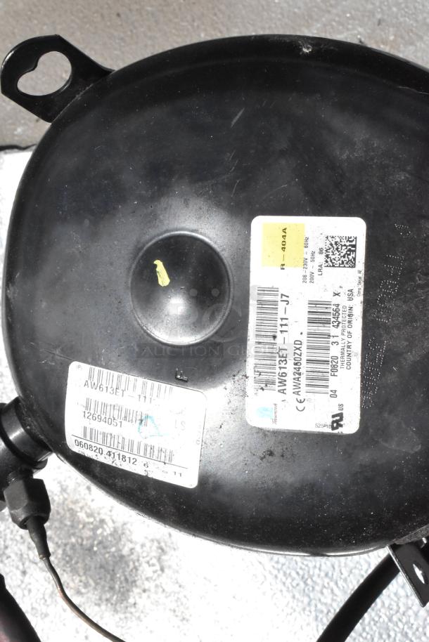 Norlake Tecumseh AW613ET-111-J7 compressor label, showing model and electrical specifications.