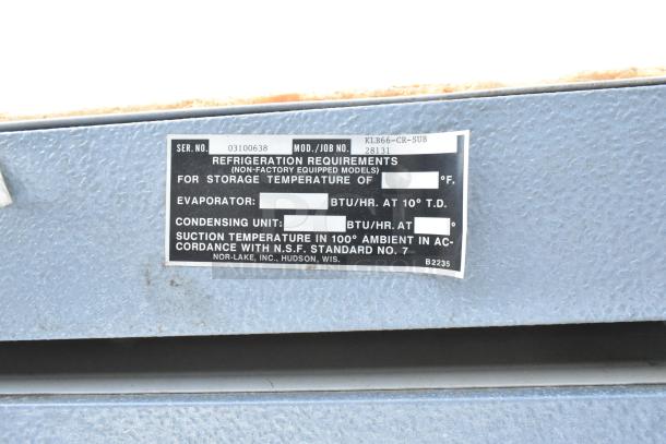 Norlake walk-in cooler label showing model KLB66-CR-SUB, serial 03100638, and NSF standards.