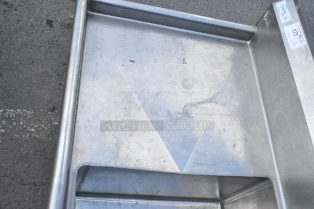 Yukon stainless steel 3 bay sink with dual drain boards, no legs, minor surface wear, model tag visible.
