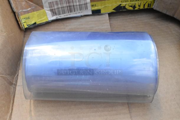 Brand new plastic strip curtain roll with minor scratches and dents; boxed with visible barcode and shipping labels.