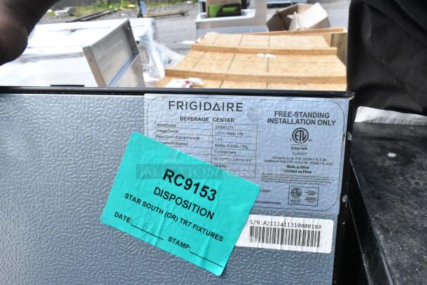 Frigidaire EFMIS155 mini cooler with label showing model and specs; includes Galanz, GE, Haier coolers; auction bundle.