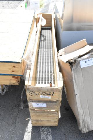 Brand new evaporator coil in a wooden crate, labels showing model number 83092061, excellent condition.