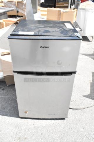 Galanz GLR31TS1E02 mini cooler with freezer, stainless steel finish, visible wear, 115 volts, 1 phase.