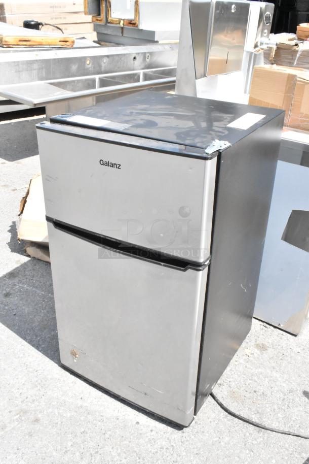 Galanz GLR31TS1E02 Mini Cooler with Freezer, 115V, 1 Phase, stainless steel, visible wear on surface.
