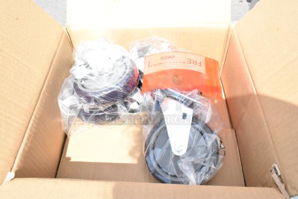 Cardboard box with packaged parts for Regency 600PHS24HC hand sink cart. Includes casters and a visible "FREE SOAP" label.
