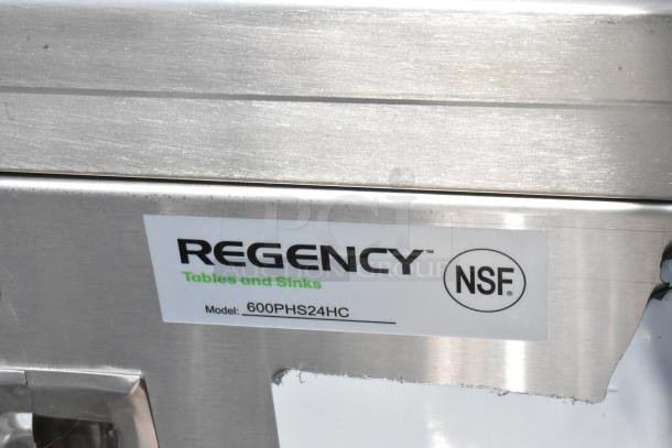 NSF-certified Regency 600PHS24HC sink cart label. Features brand, model, and confirms scratch and dent condition.