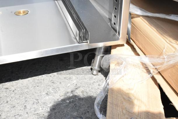 BRAND NEW Regency 600GRDB2424S 24" x 24" stainless steel glass rack unit with scratches and dents, perforated top.