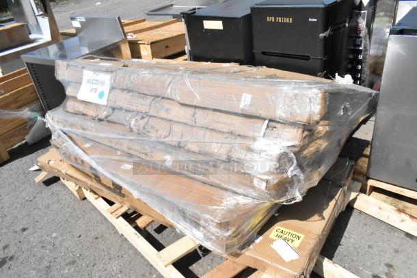 6 brand new scratch and dent items on pallets, including Regency utility sink, wire security cage, and chrome shelving post.