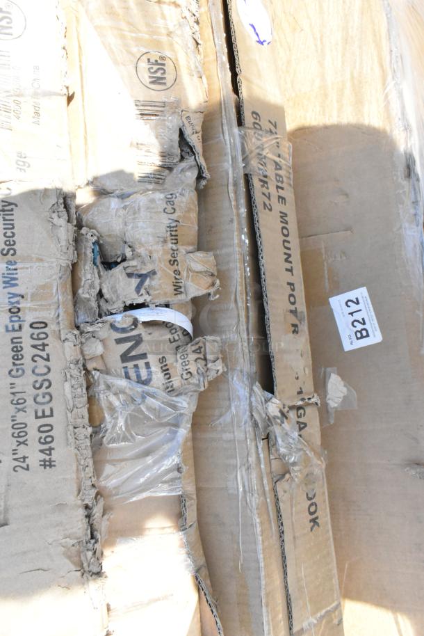 NSF labeled cardboard boxes, scratched, containing Regency utility sink, green wire security cage, and chrome shelving post.
