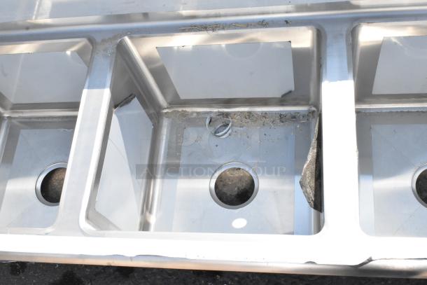 BRAND NEW Regency 600S31515215 stainless steel 3 bay sink with dual drain boards, scratch and dent condition.