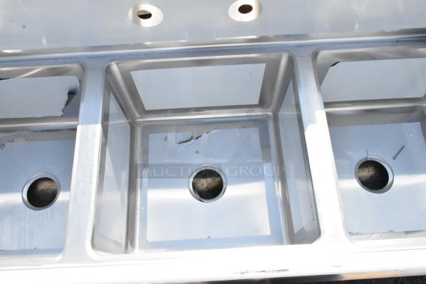 Brand new Regency 600S31717 60" stainless steel three-compartment sink with surface scratches, galvanized steel legs, 17"x17"x12" bowls.