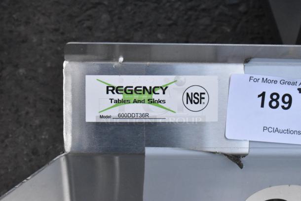 Brand new Regency 600DDT36R dish table with right drainboard, stainless steel, NSF certified, minor scratches visible.