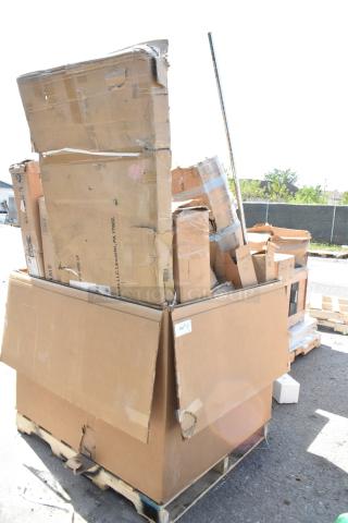 Cardboard boxes of 13 brand new scratch and dent items on a pallet, including Lancaster umbrella frame, Regency stand, Lavex dispenser.