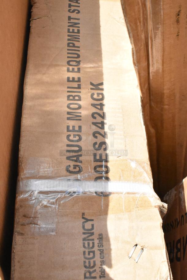 Cardboard packaging of Regency 600ES2424GK stainless steel equipment stand. Visible text displays product details.