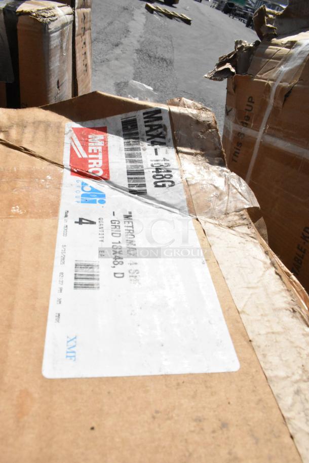 Damaged cardboard box with a Metro label, marked "Metromax" and "48x48 Grid." Some wear and tear visible on packaging.