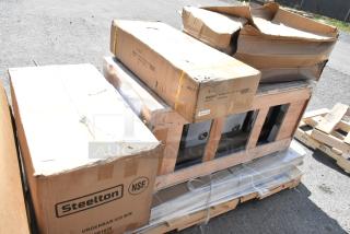 Brand new auction items on a pallet, including Steelton underbar ice bin and Regency equipment table in original packaging.