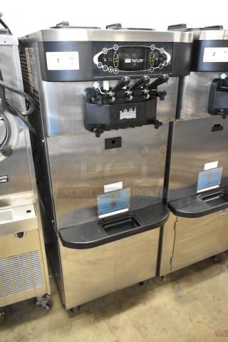 Taylor C723-33 stainless steel 2-flavor soft serve ice cream machine, water-cooled, on casters, 208-230V, 3 phase.