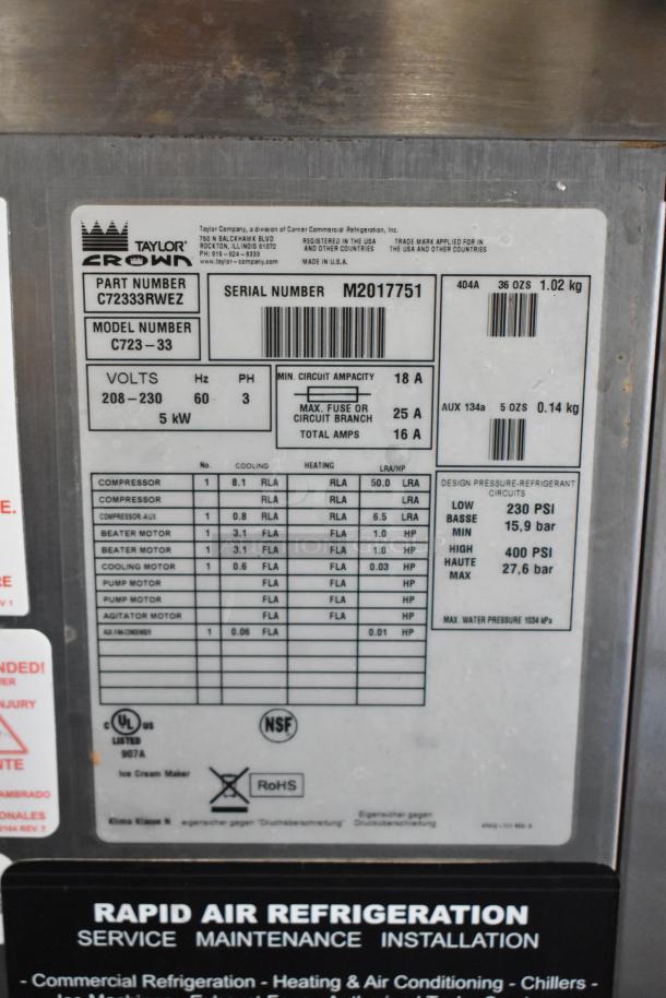 Taylor C723-33 stainless steel 2-flavor commercial soft serve ice cream machine plaque, showing model details and specifications.