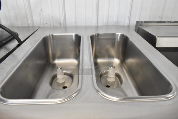 Stainless steel interior of Taylor C723-33 soft serve machine showing dual mix hoppers, in excellent condition.
