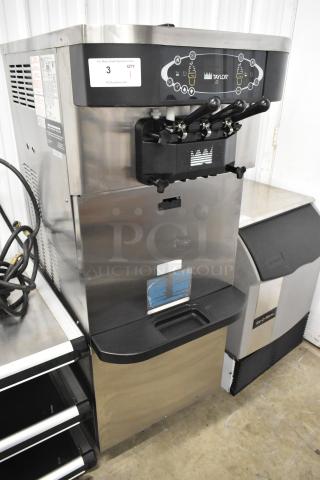 Taylor C723-33 stainless steel soft serve machine, dual flavor with twist, water-cooled, on casters, 208-230V, 3 phase.