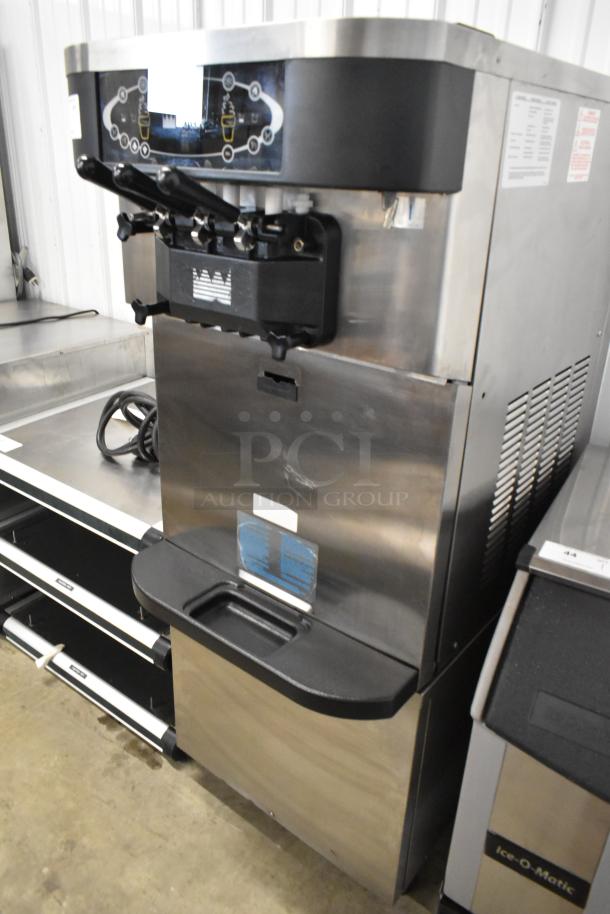 Taylor C723-33 stainless steel 2-flavor soft serve ice cream machine, water-cooled, on casters, 208-230V, 3-phase.