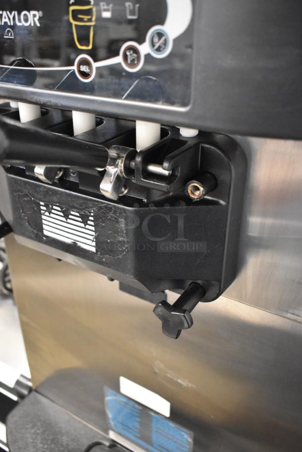 Taylor C723-33 stainless steel soft serve ice cream machine, dual flavor, twist option, on commercial casters.