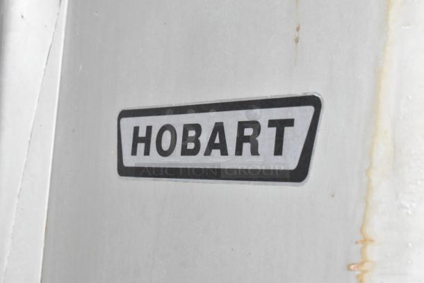 Hobart V-1401 commercial 140 qt dough mixer with bowl and hook, 200V, 3-phase. Features Hobart branding on side.