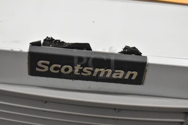 Brand new 2024 Scotsman MC1030MA-32A stainless steel ice machine head, Prodigy ELITE model, showing a label with minor damage.