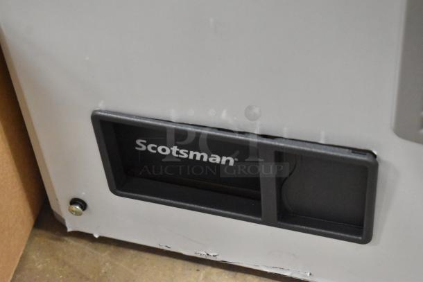 Brand new 2024 Scotsman MC1030MA-32A stainless steel ice machine head. Visible logo, minimal scratches. 208/230V, 1 phase.