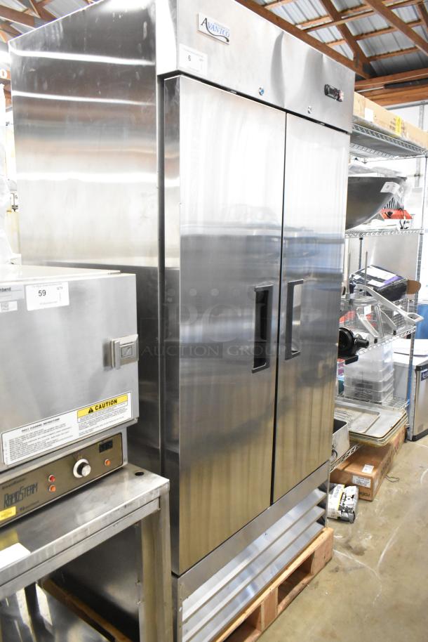 Brand new Avantco 178A35RHC stainless steel commercial 2-door reach-in cooler, scratch and dent, with poly-coated racks.
