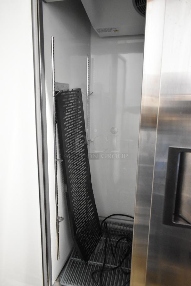 Brand new Avantco 178A35RHC stainless steel 2-door reach-in cooler, scratch and dent, with poly-coated racks, 115V, 1 phase.