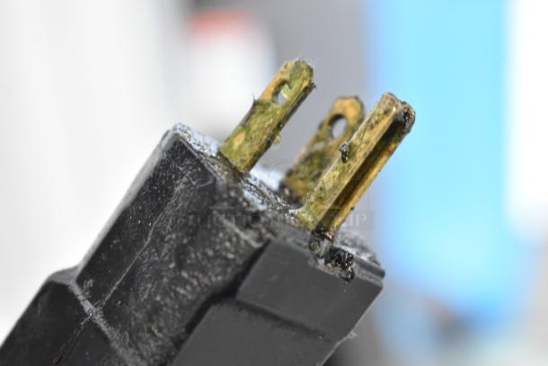 Close-up of a corroded plug from the 2016 Electrolux AOS102GTP1 commercial combi convection oven, highlighting condition issues.