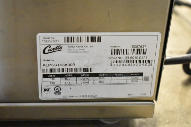 Curtis ALP3GT63A000 stainless steel 12 cup coffee brewer, 1 lower, 2 upper warmers, tags show volts and amps, scratch and dent.