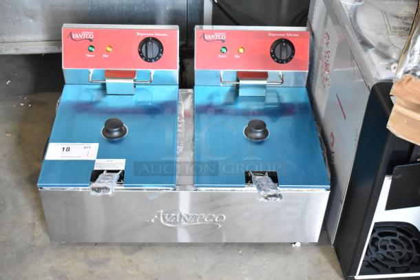 Brand new Avantco 177F102 dual tank electric countertop fryer, 20 lb. capacity, 2 metal baskets, and lids, 120 volts, 1 phase.