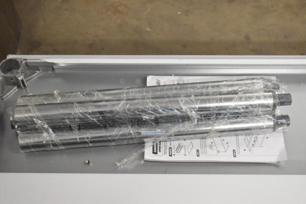 Stainless steel ServIt 423EST3WO electric steam table parts wrapped in plastic with instruction manual.