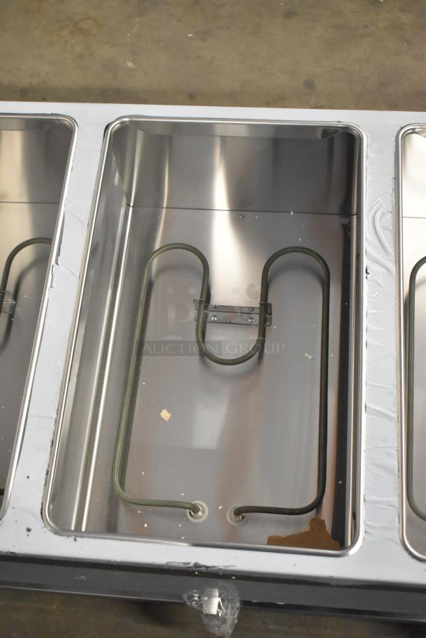 Brand new ServIt 423EST3WO electric steam table, stainless steel, three-pan open well, adjustable undershelf, 120V, 1 phase.