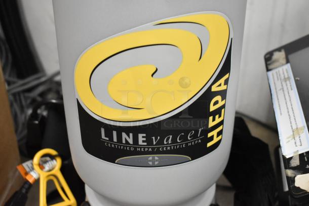 ProTeam LV-100 Backpack Vacuum, certified HEPA, 120V, 1 Phase, new with minor scratches and dents. LineVacer label visible.